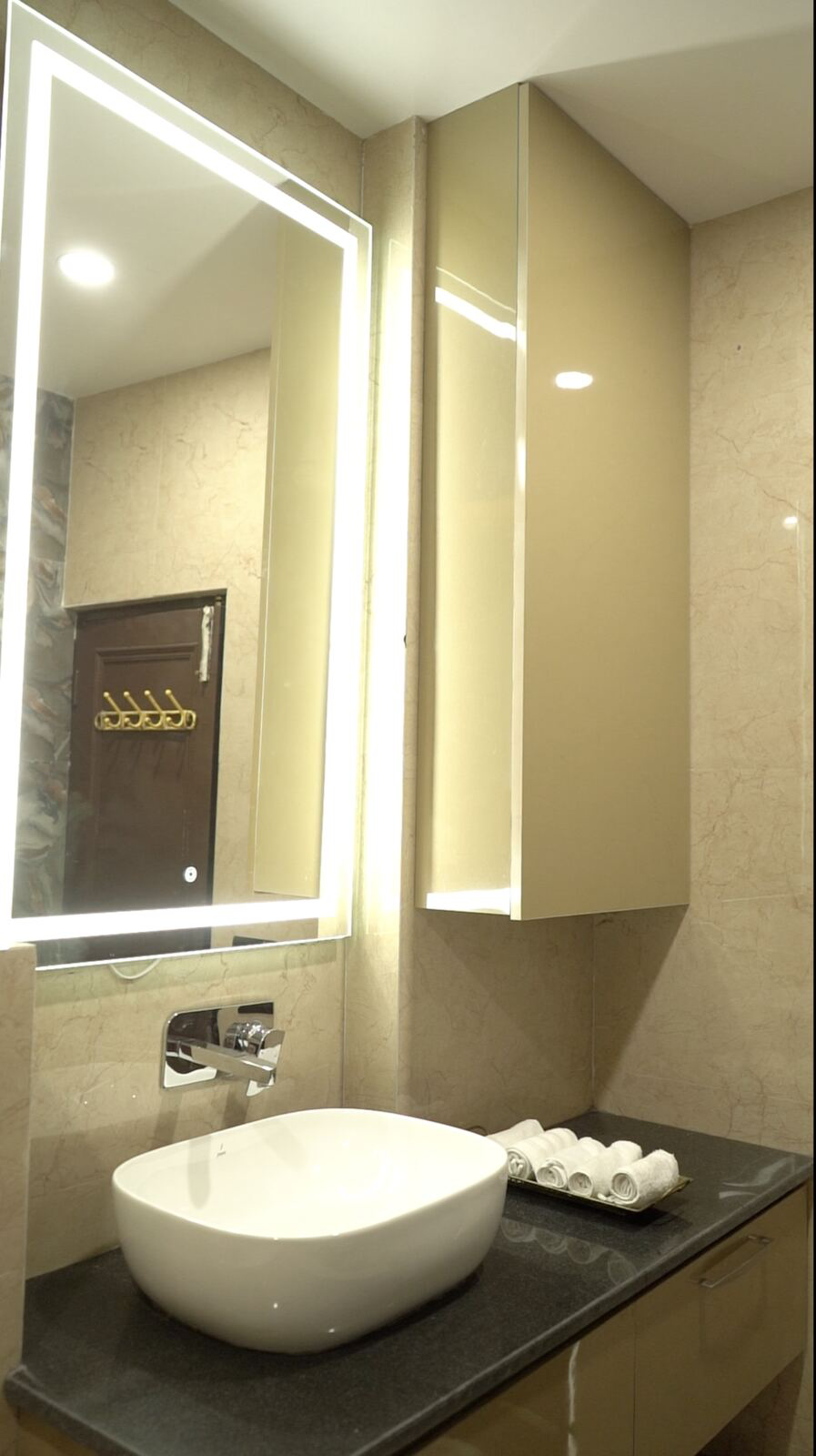 Samsara Residence bathroom mirror and storage cabinetry
