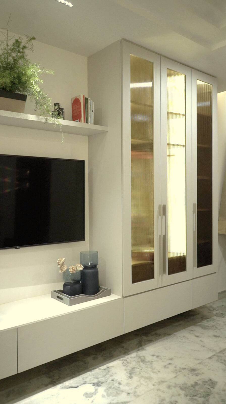 Samsara Residence bedroom with fluted glass wardrobe