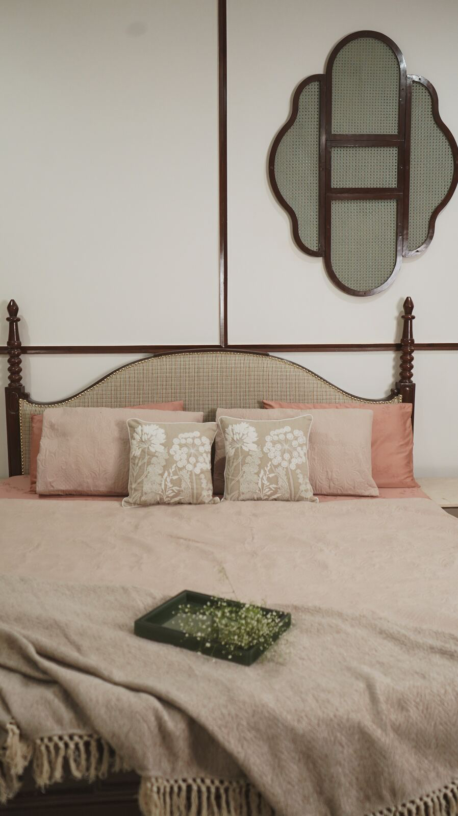 Samsara Residence bedroom with cane wall mirror