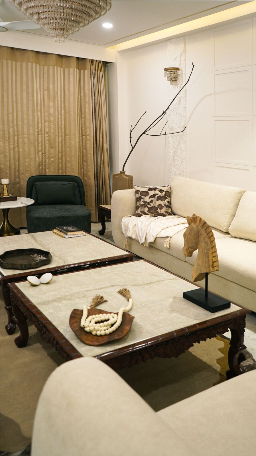 Samsara Residence living room seating with wooden horse sculpture