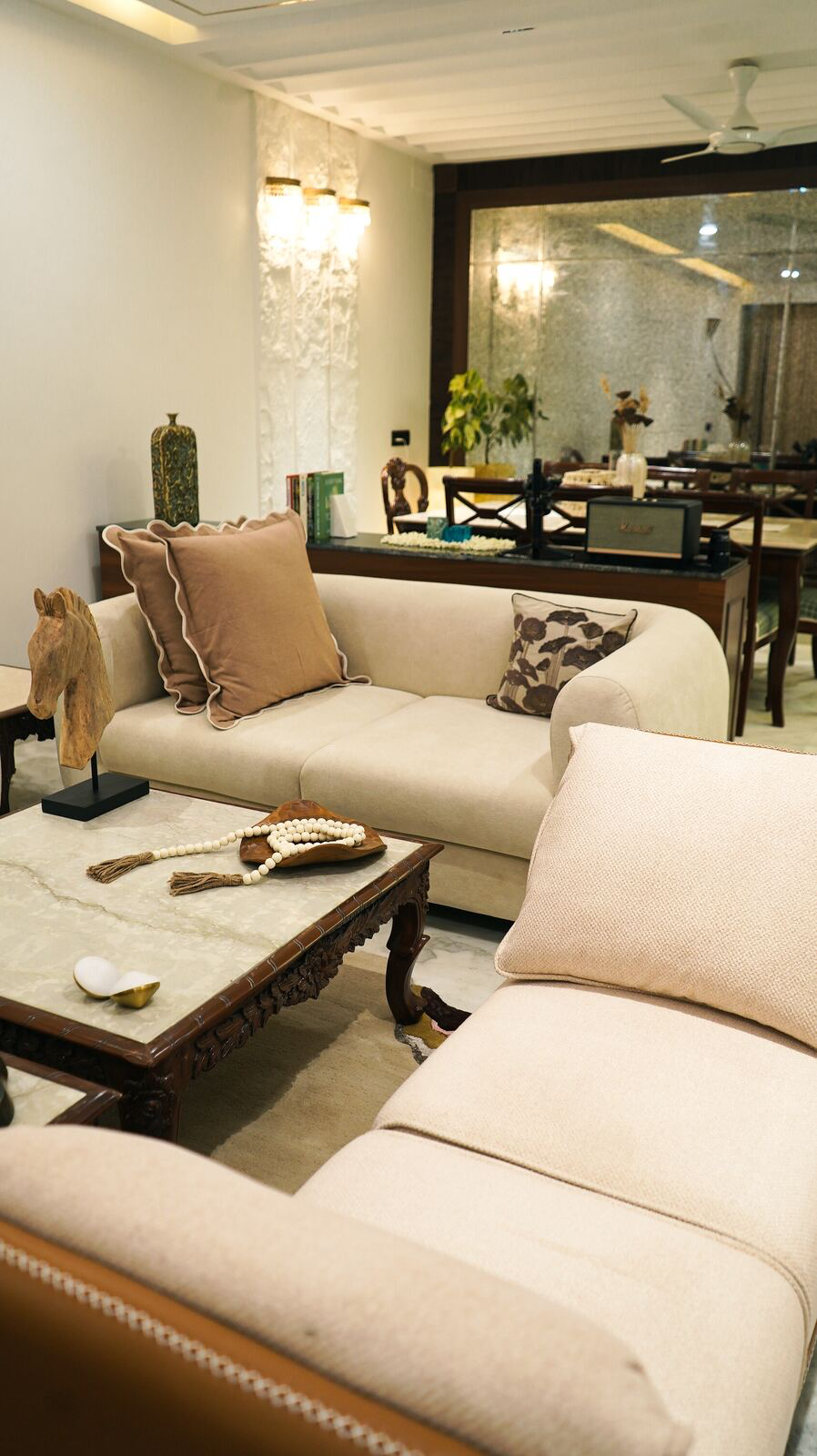 Samsara Residence living room with antique mirror and dining beyond