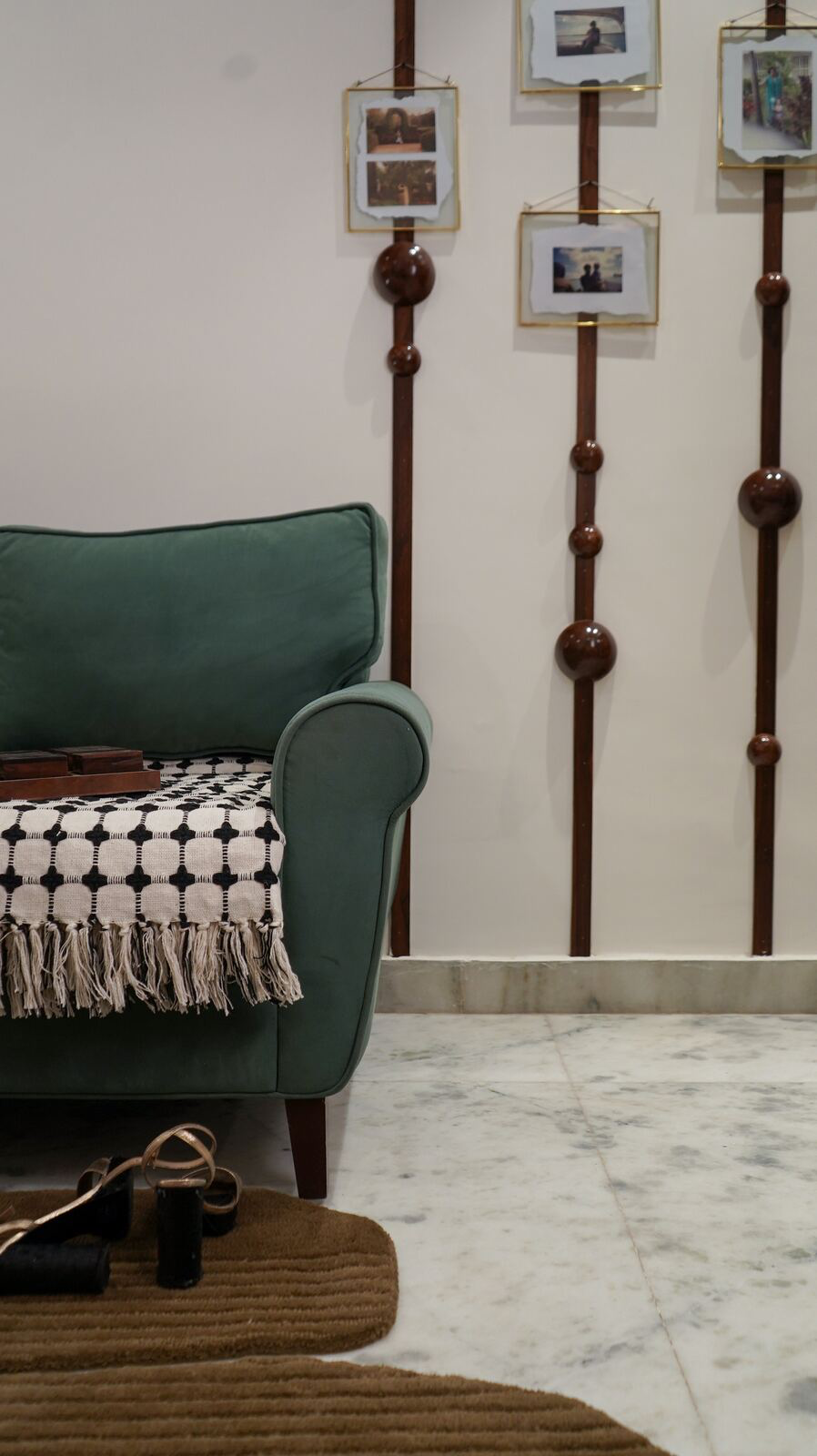 Samsara Residence lounge corner with hanging photo frames